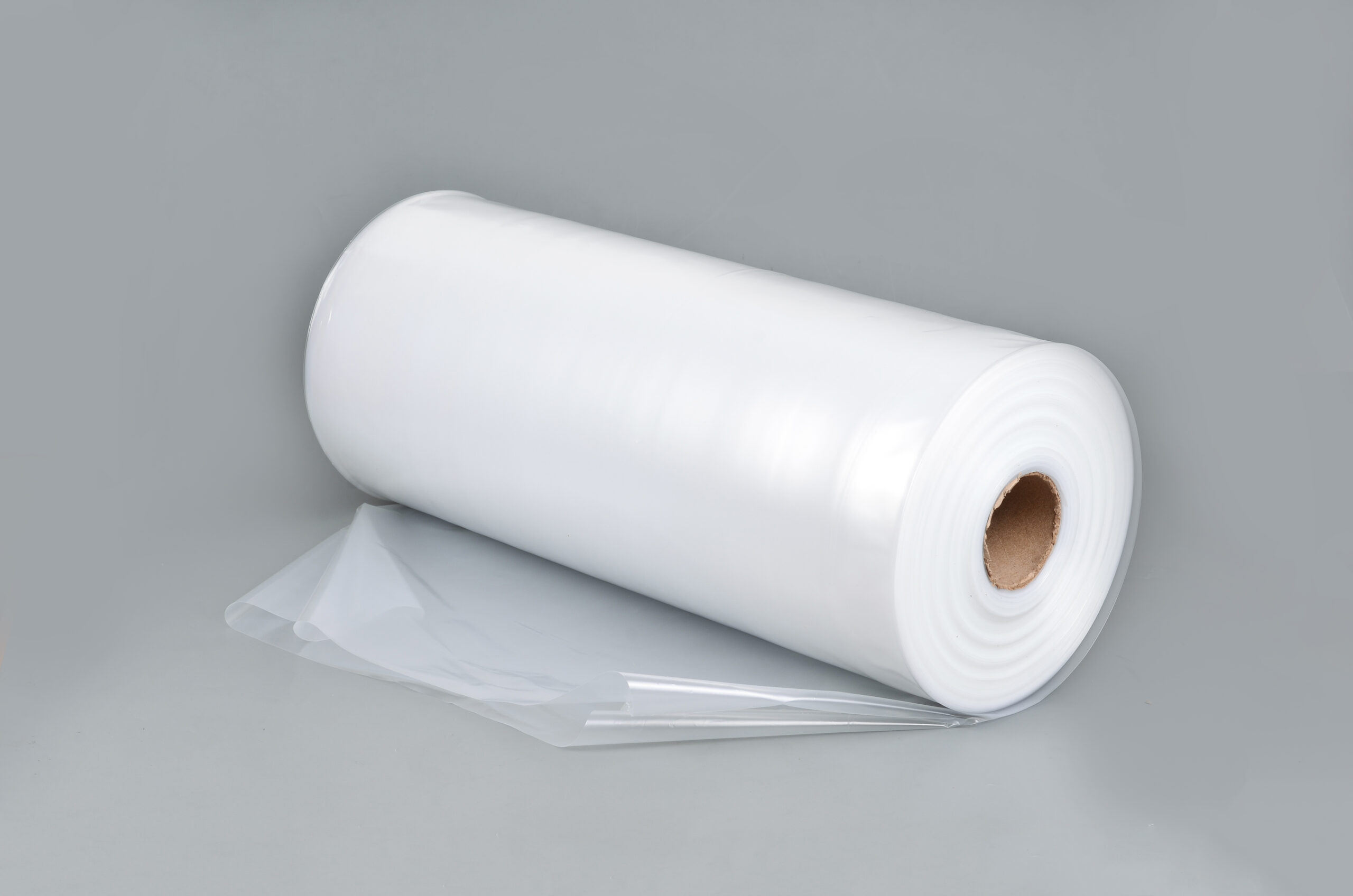 Transparent,Plastic,Bag,In,A,Roll,On,A,Gray,Background.